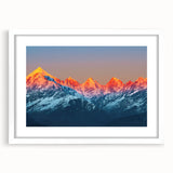 Abstract art print of a stylized Indian landscape in vibrant orange and red tones on a white framed canvas.
