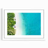 Abstract art print depicting serene Maldivian scenery in soft blue and white tones, framed with a white mat.