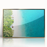 Large art print of a serene Maldivian beach scene in muted blue and sand tones, framed in gold acrylic.