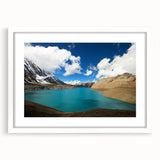 Abstract art print of a Nepalese landscape in muted earth tones on a framed white mat, suitable for dining room decor.