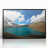 Large abstract wall art depicting a stylized Nepalese landscape in muted earth tones, framed in black acrylic.