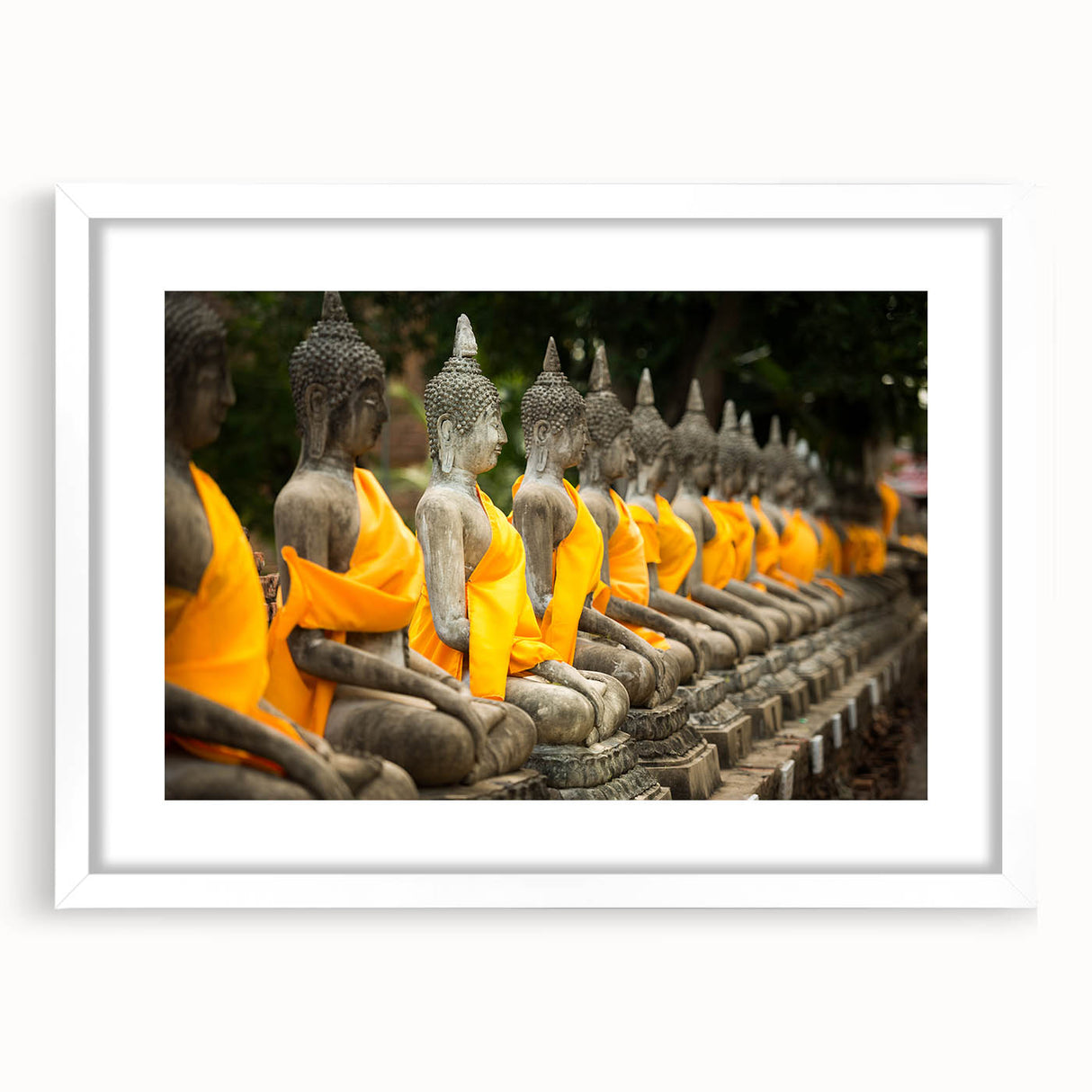 Abstract art print featuring a serene Thai landscape in soft blue and green tones, framed in white.