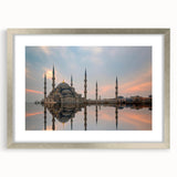 Textured abstract art print featuring muted earth tones, framed in silver, ideal for bedroom wall decor.