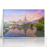 Art deco poster of a Vietnamese landscape in muted greens and browns, acrylic print framed in white.