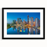 Extra large abstract art print of a colorful Brisbane skyline on a textured canvas, framed in black.