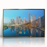 Mid-century modernist art of Brisbane skyline in muted gold and blue tones on a framed acrylic, ideal for nursery wall decor.