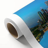 Art deco poster of Brisbane skyline in pastel blues and pinks on rolled canvas, ideal for nursery wall art.