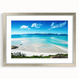 Abstract art print of the Great Barrier Reef in turquoise and blue shades on a framed canvas, ideal for dining room decor.