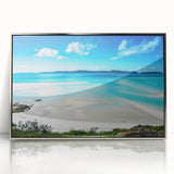 Acrylic print of the Great Barrier Reef in vivid blue tones, framed in silver, suitable for modern art wall decor.