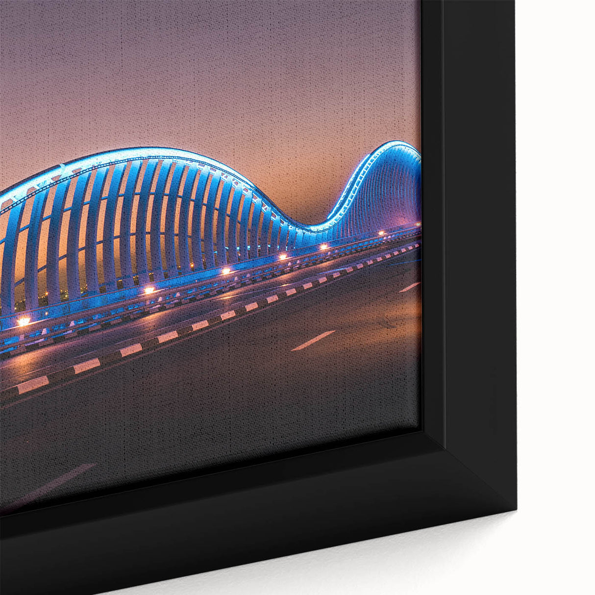 Close-up of black wall art featuring a textured Sydney skyline in colorful hues on a framed canvas.