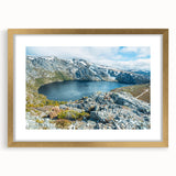 Abstract art print of Tasmania scenery in muted earth tones on a gold-framed canvas.