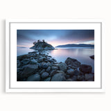 Abstract art print depicting a tranquil British Columbia landscape in cool blue and green tones, framed with a white mat.