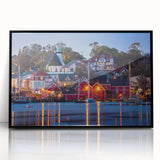 Large abstract wall art depicting a Nova Scotia scenery in muted blue and green tones, framed in black acrylic.