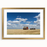Extra large abstract art print depicting textured scenery of Saskatchewan in a gold frame, ideal for living room decor.