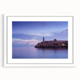 Textured abstract art print of a Caribbean scene in muted blue and green hues, framed with a white mat.