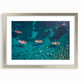 Extra large abstract art print depicting Caribbean scenery in textured shades of blue and green, framed in silver.