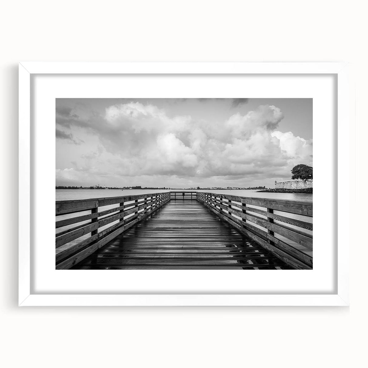 Textured art of an abstract Caribbean scenery in muted blue and green hues, framed with a white mat.