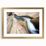 Abstract art print depicting the Caribbean landscape in vibrant blue and green hues on a framed canvas.