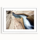 Textured art print of an abstract Caribbean landscape in blue and green tones, framed with a white mat.
