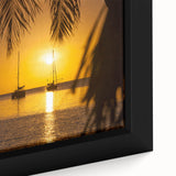 Framed canvas of a Caribbean beach scene, featuring textured black sand and vibrant ocean blues, ideal for living room decor.