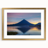 Extra large abstract art print of a Central American landscape in muted earth tones on a textured canvas, framed in gold.