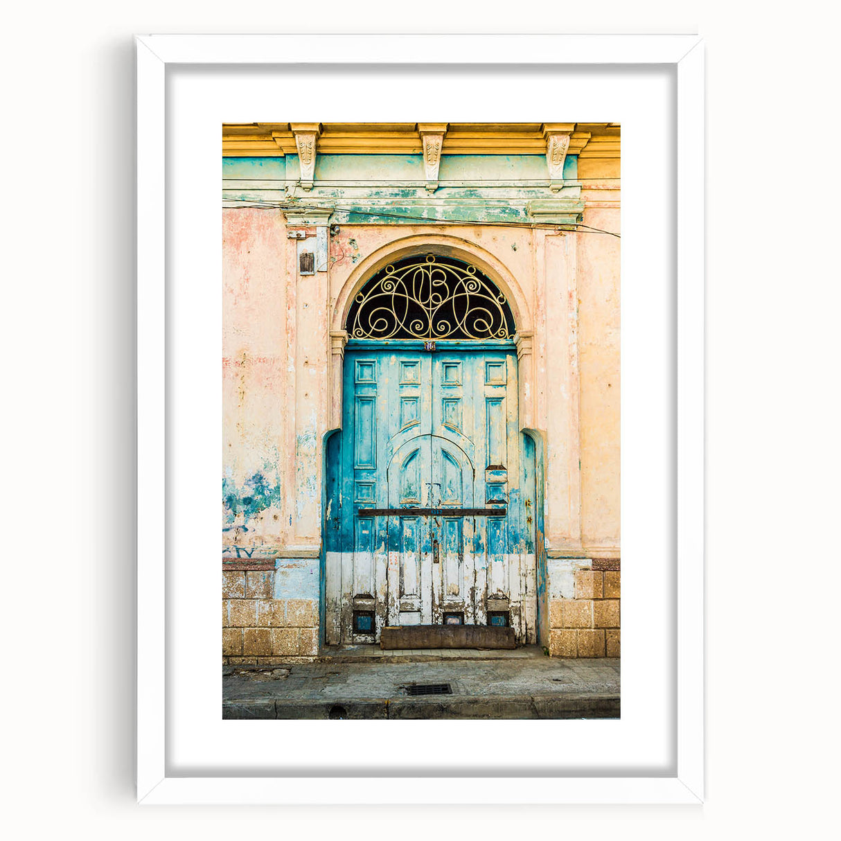 Abstract art print of Central American scenery in muted earth tones on a white framed canvas, suitable for dining room decor.