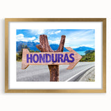 Abstract art print featuring textured patterns in earthy tones, framed in gold.