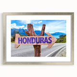 Textured abstract art print featuring muted earth tones on a framed silver mat, suitable for bedroom decor.