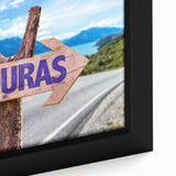 Extra large framed canvas featuring a textured depiction of a Central American rural scene in black with colorful accents.