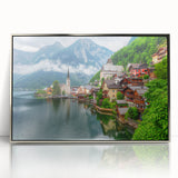 Large art print of a serene Austrian landscape in muted green and blue tones, framed in silver acrylic.