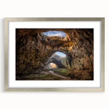 Extra large abstract art print of a textured European scenery in muted earth tones, framed in silver.