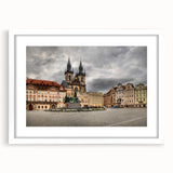 Abstract art print of Prague skyline in muted gray and blue tones on a framed white mat, suitable for dining room decor.