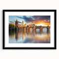 Colorful abstract art print of European scenery in a black frame, ideal for living room decor, with textured appearance.