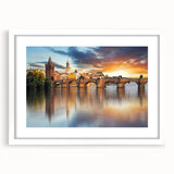 Textured abstract art print of a European scenery in muted earth tones, framed with a white mat, suitable for bedroom decor.