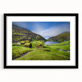 Colorful abstract art print of a European scenery in muted tones on a large framed canvas, suitable for living room decor.