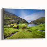 Framed canvas featuring a vintage-style landscape painting of a Danish scenery in muted colors.