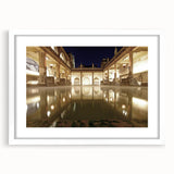 Textured abstract art print of a European cityscape in muted earth tones, framed in white, ideal for bedroom wall decor.