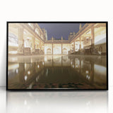 Large abstract wall art depicting a European cityscape in muted gray and blue tones, framed in black acrylic.