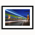 Colorful abstract art print of London scenery in vibrant hues on a large black-framed canvas, ideal for living room decor.