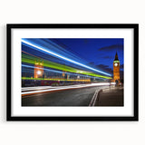 Colorful abstract art print of London scenery in vibrant hues on a large black-framed canvas, ideal for living room decor.