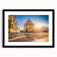 Colorful abstract art print of Oxford scenery in vibrant hues on a black framed canvas, ideal for living room decor.