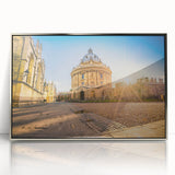 Mid-century modernist acrylic print of Oxford scenery in muted earth tones, framed in silver.