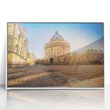 Mid-century modernist Oxford scenery in acrylic print, framed, featuring muted earth tones, ideal for nursery wall art.