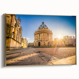 Framed canvas of a vintage Oxford landscape in muted gold and black tones, ideal for bedroom wall art.