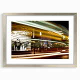 Extra large abstract art print of Piccadilly, England, in muted earth tones, framed in silver.