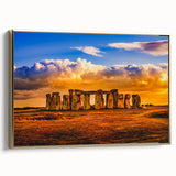 Framed canvas wall art featuring a vintage-style painting of Stonehenge in muted earth tones, ideal for bedroom decor.
