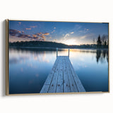 Framed canvas featuring a vintage-style landscape painting of a serene Finnish scenery in muted gold and black tones.