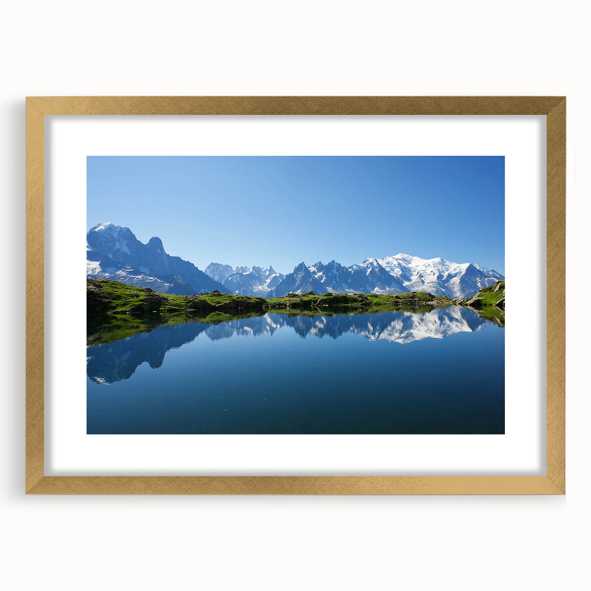 Abstract art print of the French Alps in muted green and blue tones, framed in gold, ideal for dining room decor.