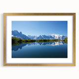 Abstract art print of the French Alps in muted green and blue tones, framed in gold, ideal for dining room decor.