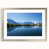 Extra large abstract art print of the French Alps in textured hues of blue and white, framed in silver.